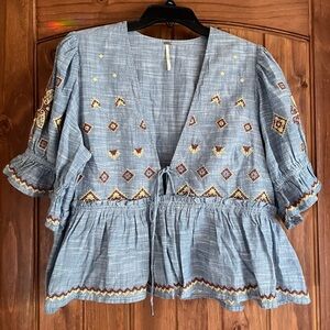 Free People Large NWOT Blouse in denim blue with beautiful brown and tan detail!